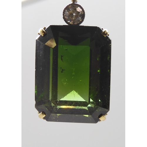 853 - A 15CT TOURMALINE AND DIAMOND PENDANTmounted in yellow and white metal, the emerald cut tourmaline m... 