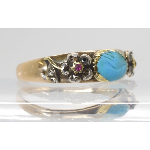 855 - A MOURNING RINGin yellow metal, set with diamond and ruby forget-me-not flowers and a turquoise carv... 