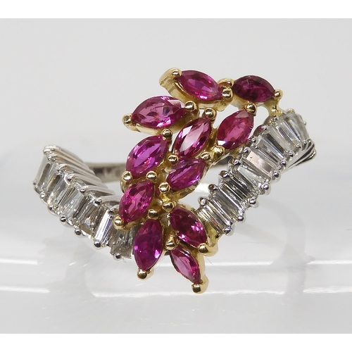 878 - A RUBY AND DIAMOND STATEMENT RINGset throughout in 18ct white gold, the baguette cut diamonds are es... 