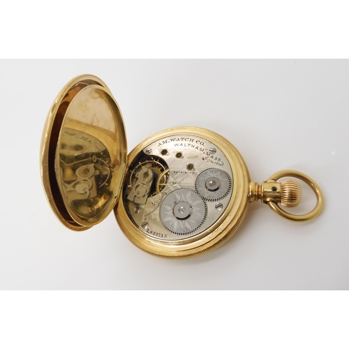 903 - AN 18CT GOLD WALTHAM FULL HUNTER with white enamelled dial with black Roman numerals and subsidiary ... 