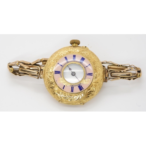 906 - AN 18K GOLD HALF HUNTER WRISTWATCHthe decorative pink guilloche enamel chapter ring with blue enamel... 