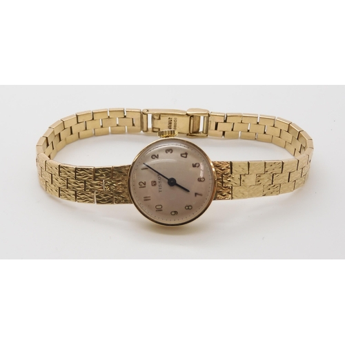 A 9CT GOLD LADIES TISSOT WATCHArabic numerals to the dial with