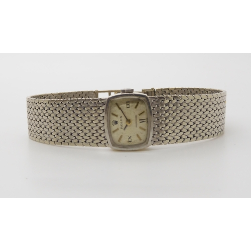 911 - A 9CT WHITE GOLD LADIES ROLEX PRECISIONwith oblong case and integral woven strap. Dimensions of the ... 