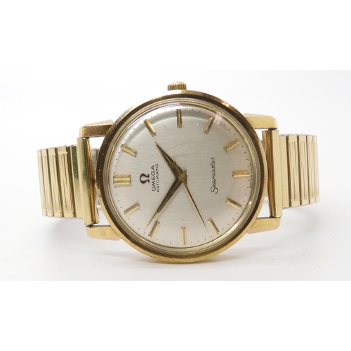 919 - A 9CT GOLD GENTS OMEGA SEAMASTER AUTOMATICwith silvered dial with gold coloured baton numerals, diam... 