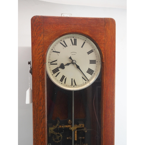 601 - A SYNCHRONOME ELECTRIC MASTER WALL CLOCKsilver coloured dial in oak glazed case, with pendulum, 127c... 