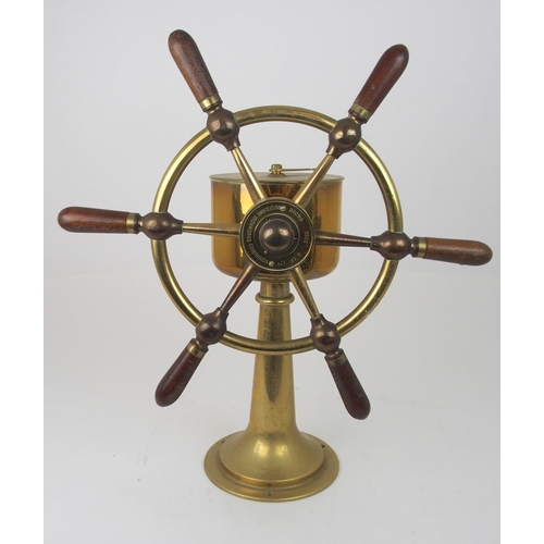 609 - A BRASS SHIP'S TELEGRAPHby Chadburns Liverpool and London, 48cm high on circular hardwood base and a... 