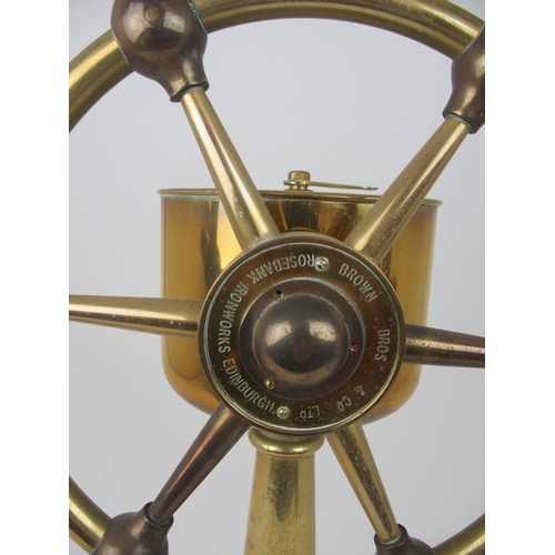 609 - A BRASS SHIP'S TELEGRAPHby Chadburns Liverpool and London, 48cm high on circular hardwood base and a... 