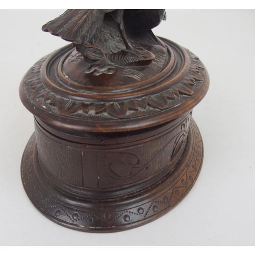 615 - A VICTORIAN OVAL BLACK FOREST JEWELLERY CASKETthe lid surmounted by carved birds, 21cm wide... 