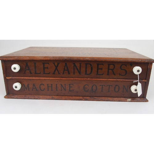 617 - A R.F. & J. ALEXANDER & CO., LTD STAINED PINE COUNTER REEL CHESTthe front with two drawers i... 