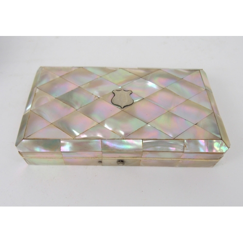 620 - A MOTHER OF PEARL SEWING KITwith mother of pearl accessories, 15cm, and another velvet sewing case w... 