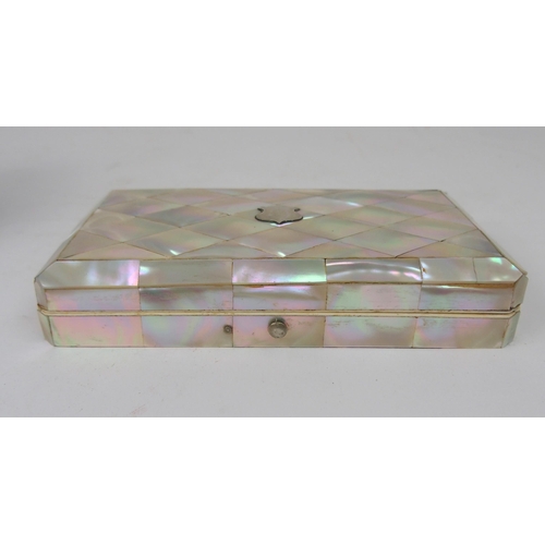 620 - A MOTHER OF PEARL SEWING KITwith mother of pearl accessories, 15cm, and another velvet sewing case w... 