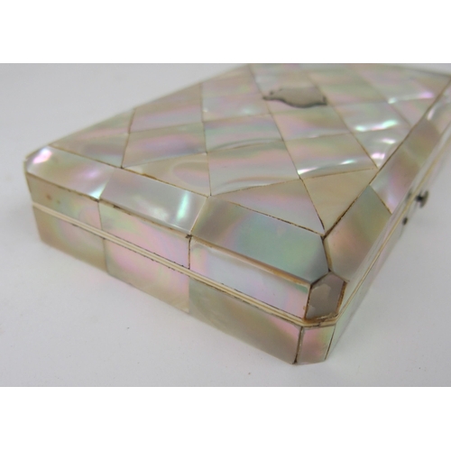 620 - A MOTHER OF PEARL SEWING KITwith mother of pearl accessories, 15cm, and another velvet sewing case w... 