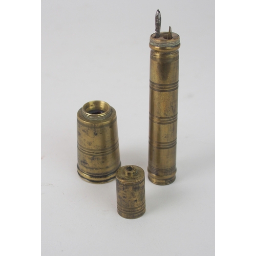 641 - A BRASS PENNERwith tapering inkwell and accessories, 14cm high