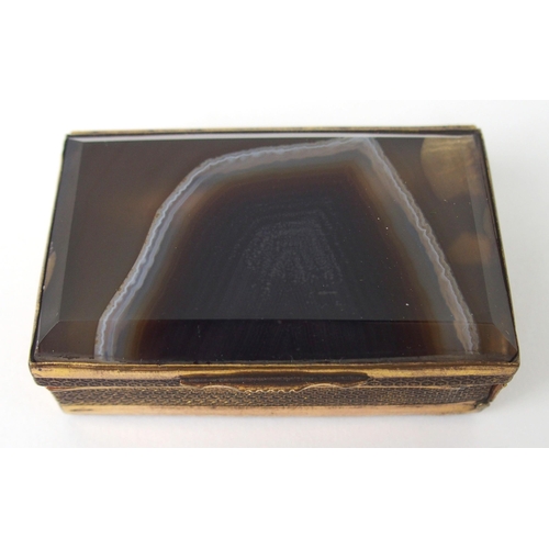 643 - A GILT-METAL AND AGATE SEAL BOXwith hinged lid and side, the side opening to reveal candle holder wi... 