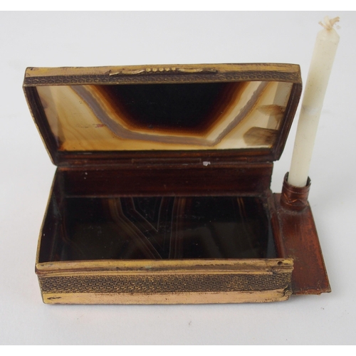 643 - A GILT-METAL AND AGATE SEAL BOXwith hinged lid and side, the side opening to reveal candle holder wi... 