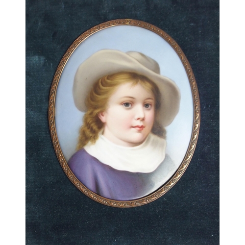 645 - A CONTINENTAL PORCELAIN PORTRAIT PLAQUEdepicting a child wearing a hat in gilt-metal frame, 12.5 x 1... 