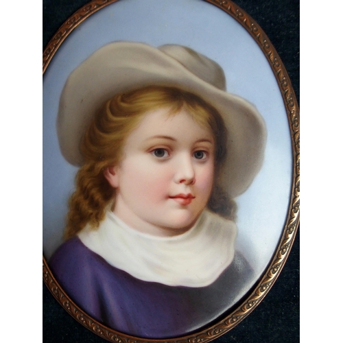 645 - A CONTINENTAL PORCELAIN PORTRAIT PLAQUEdepicting a child wearing a hat in gilt-metal frame, 12.5 x 1... 