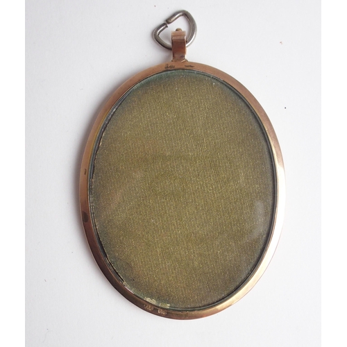 647 - A PAINTED PORTRAIT OVAL MINIATURE OF A GENTLEMANwearing a suit, in a 9ct gold frame, 8 x 6cm... 