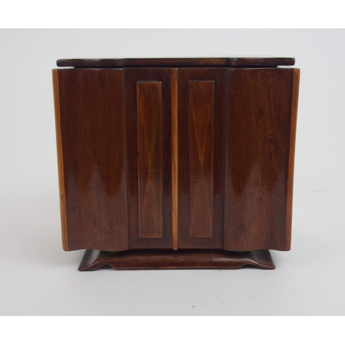 660 - AN ART DECO SPECIMAN WOOD SERPENTINE TEA CADDYmodeled as a sideboard with shaped inlaid hinged lid a... 