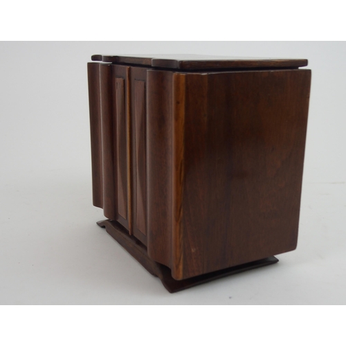 660 - AN ART DECO SPECIMAN WOOD SERPENTINE TEA CADDYmodeled as a sideboard with shaped inlaid hinged lid a... 