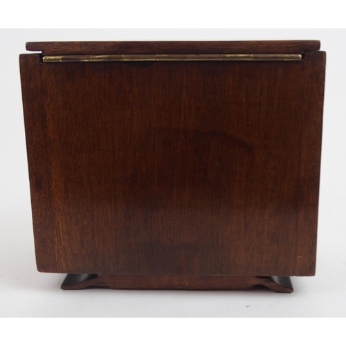 660 - AN ART DECO SPECIMAN WOOD SERPENTINE TEA CADDYmodeled as a sideboard with shaped inlaid hinged lid a... 