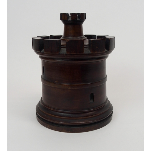 666 - A MAHOGANY TURRET TOBACCO JARof circular form with castellations, removable lid, 20cm high... 