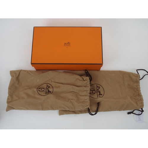 667 - A PAIR OF HERMES LADIES TAN LEATHER LOAFERSsize 38.1/2, unused, in original box... 