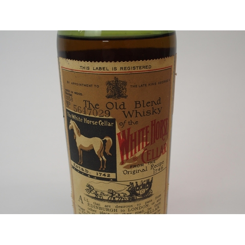 701 - A BOTTLE OF WHITE HORSE WHISKYbottled 1938, No. 5647029, below shoulder