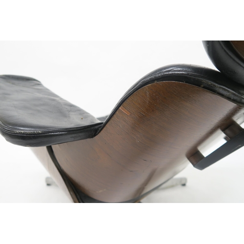 101 - A MID 20TH CENTURY AFTER CHARLES AND RAY EAMES FOR HERMAN MILLER LOUNGE CHAIR AND STOOLwith black le... 