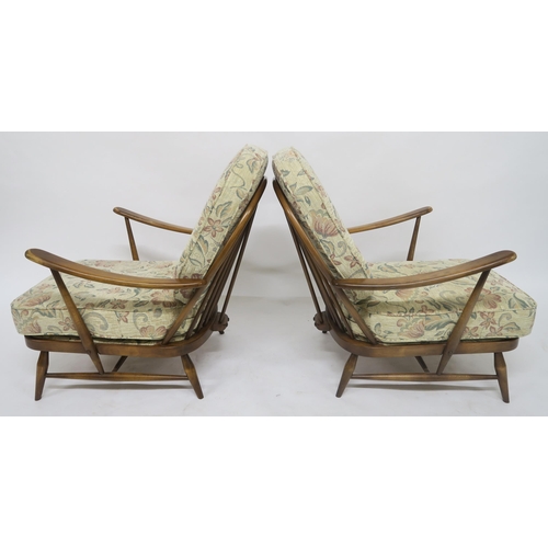 105 - A MID 20TH CENTURY ELM AND BEECH ERCOL THREE PIECE SUITEcomprising three seater settee, 78cm high x ... 