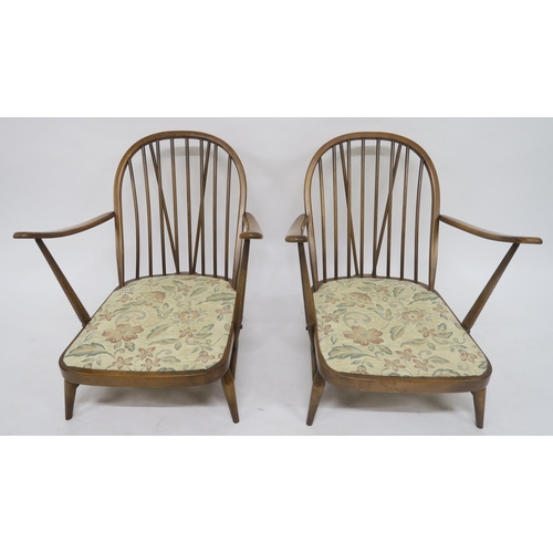 105 - A MID 20TH CENTURY ELM AND BEECH ERCOL THREE PIECE SUITEcomprising three seater settee, 78cm high x ... 