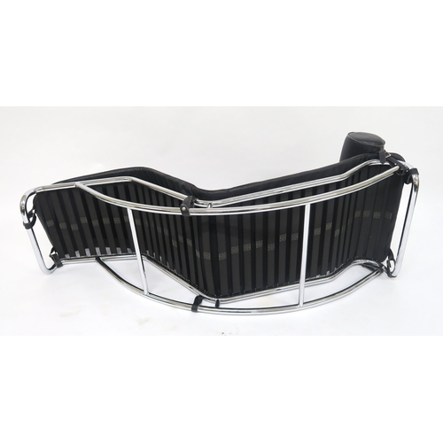 108 - A 20TH CENTURY CHROME AND BLACK LEATHER UPHOLSTERED CHAISE LOUNGE IN THE MANNER OF LE CORBUSIERon a ... 