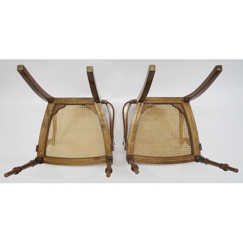 11 - A PAIR OF EARLY 20TH CENTURY SHERATON REVIVAL OPEN ARMCHAIRSwith cane seat and oval back centred in ... 