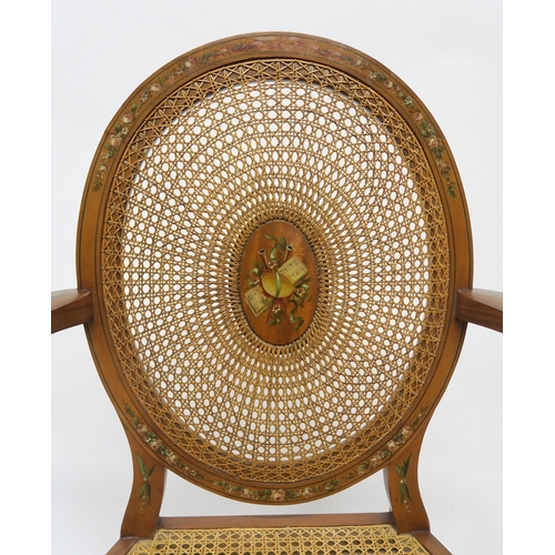 11 - A PAIR OF EARLY 20TH CENTURY SHERATON REVIVAL OPEN ARMCHAIRSwith cane seat and oval back centred in ... 