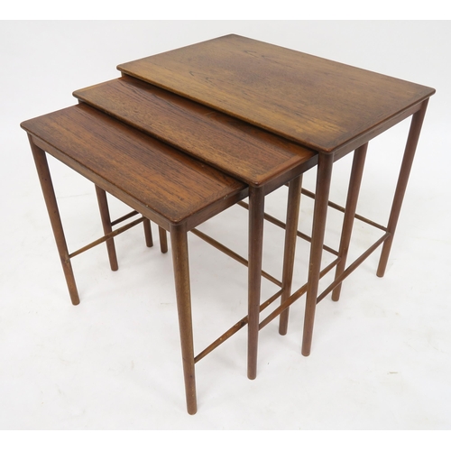 114 - A MID 20TH CENTURY POUL JEPPESEN, DENMARK TEAK NEST OF THREE TABLESwith rectangular tops on stretche... 