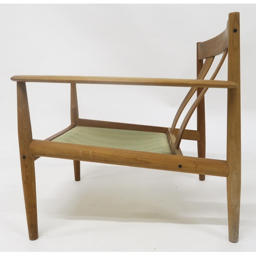 118 - A MID 20TH CENTURY TEAK GRETE JALK FOR FRANCE & SON EASY CHAIRwith two slat back seat on turned ... 