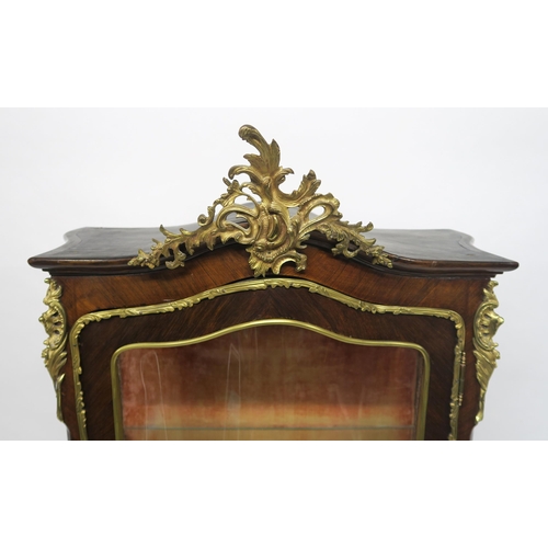 12 - A FRENCH KINGSWOOD BOMBE VITRINEwith gilt metal mounts and painted panel depicting lady and gentlema... 