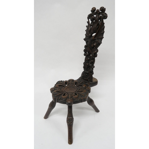 14 - A VICTORIAN OAK SPINNING CHAIRwith extensively carved seat and back depicting a stylistic seahorse o... 