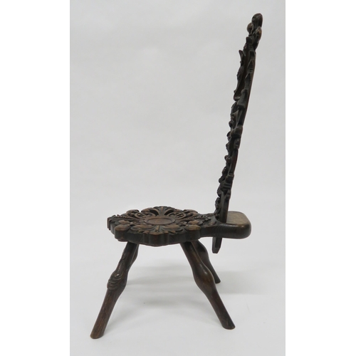 14 - A VICTORIAN OAK SPINNING CHAIRwith extensively carved seat and back depicting a stylistic seahorse o... 