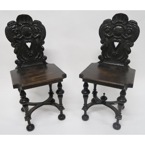 15 - A PAIR OF VICTORIAN OAK HALL CHAIRSwith carved backs depicting lions rampant flanking central cartou... 
