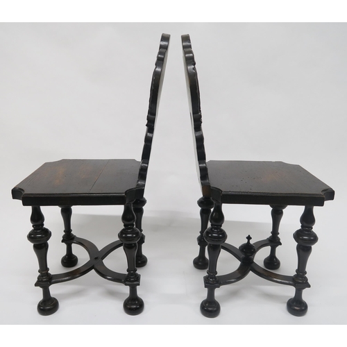 15 - A PAIR OF VICTORIAN OAK HALL CHAIRSwith carved backs depicting lions rampant flanking central cartou... 
