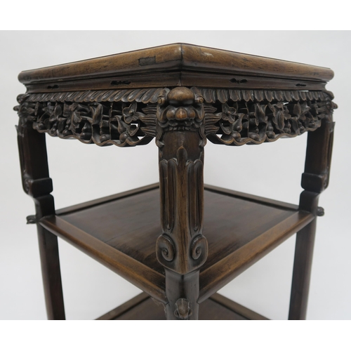 18 - A 19TH CENTURY CHINESE HARDWOOD THREE TIER PEDESTAL TABLEwith pink marble top, carved foliate fretwo... 