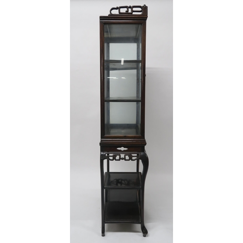 19 - A 19TH CENTURY CHINESE HARDWOOD GLAZED DISPLAY CABINET ON STANDwith carved fretwork cornice and frie... 