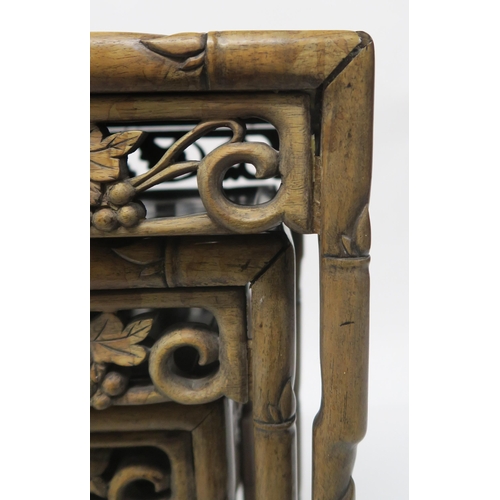20 - A 19TH CENTURY CHINESE FAUX BAMBOO HARDWOOD NEST OF FOUR TABLESwith carved foliate fretwork friezes,... 