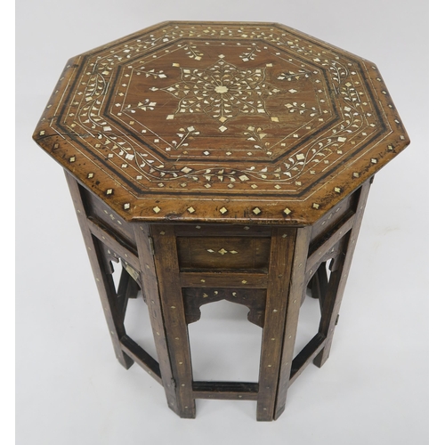 22 - AN EARLY 20TH CENTURY BRASS TOPPED FOLDING BENARES TABLEinlaid with copper and steel depicting Arabi... 