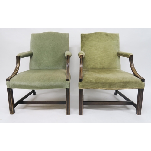 26 - A PAIR OF GEORGIAN MAHOGANY FRAMED GREEN UPHOLSTERED OPEN ARMCHAIRSon stretchered square reeded supp... 