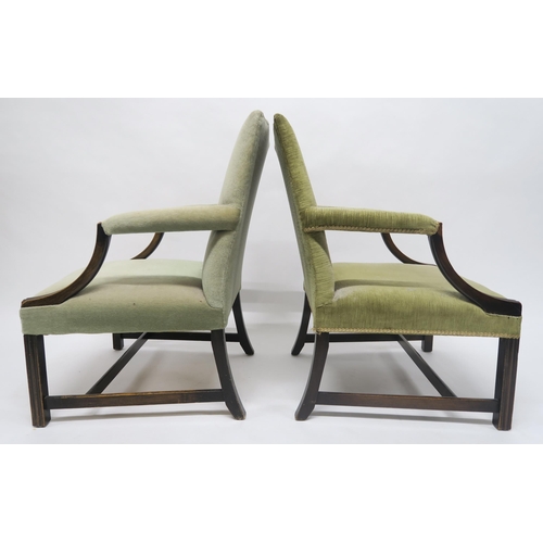 26 - A PAIR OF GEORGIAN MAHOGANY FRAMED GREEN UPHOLSTERED OPEN ARMCHAIRSon stretchered square reeded supp... 