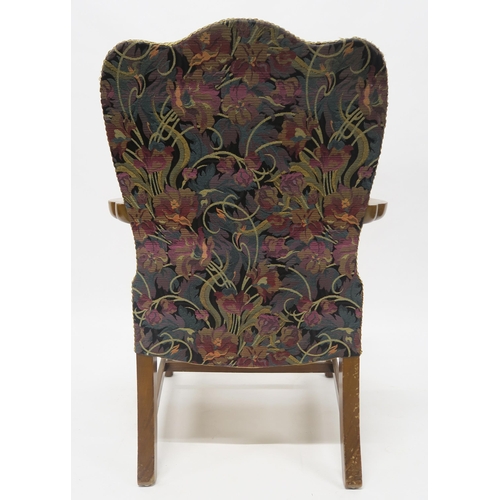 27 - A GEORGIAN MAHOGANY FRAMED HUMPBACK OPEN ARMCHAIRwith floral upholstery on stretchered square suppor... 