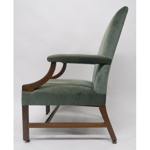 29 - A GEORGIAN MAHOGANY FRAMED OPEN ARMCHAIRwith green upholstery on stretchered square supports, 105cm ... 