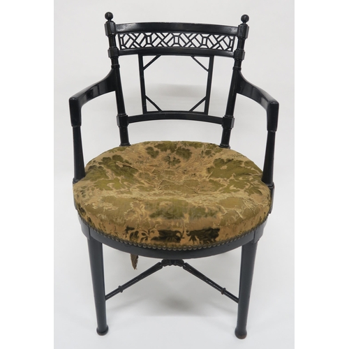 3 - A VICTORIAN EBONISED CHAIR IN THE MANNER OF E.W. GODWINwith foliate upholstered seat, fretwork back ... 